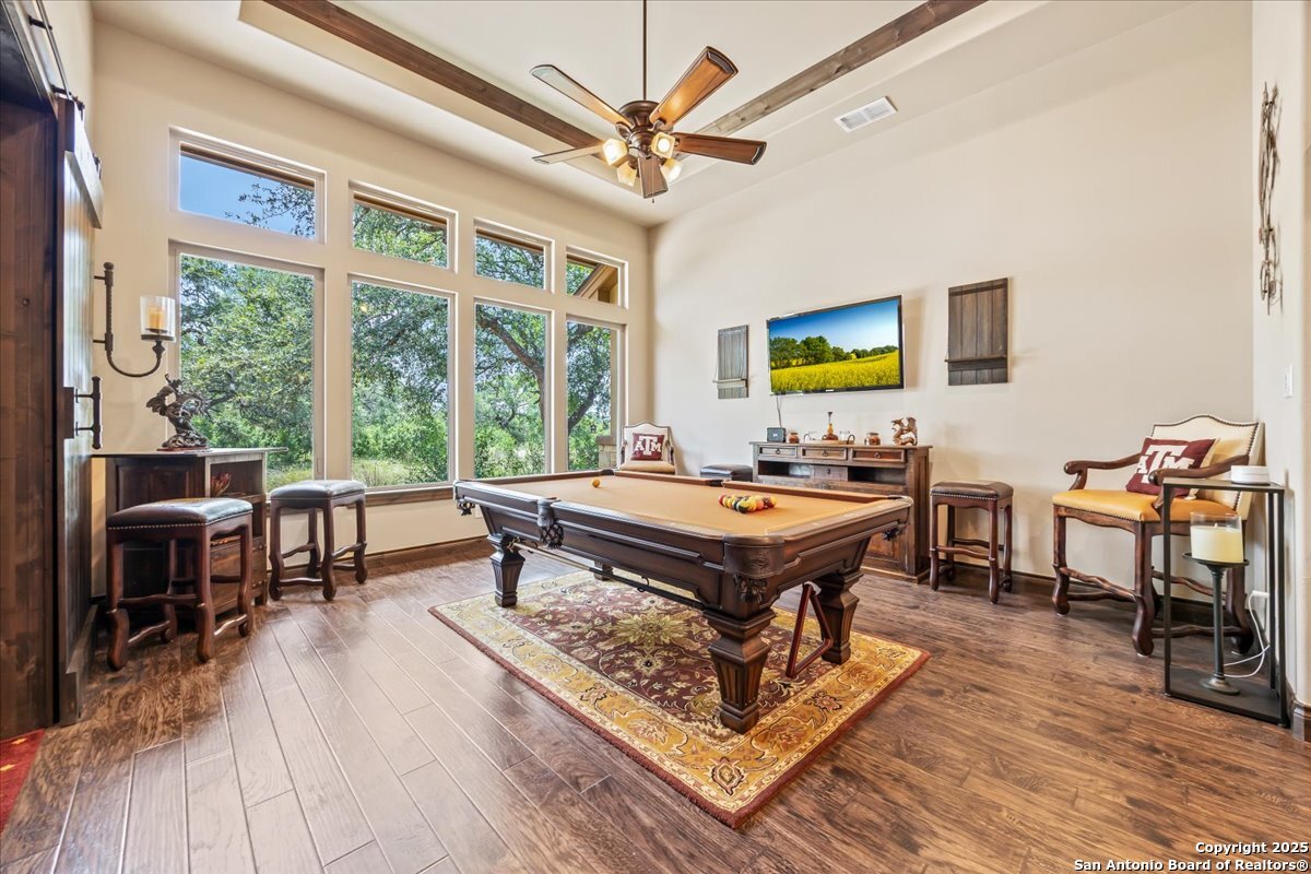 742 Pacific Spring Branch, TX 78070 - Photo 25 of 52 a living room with furniture a rug and a large window