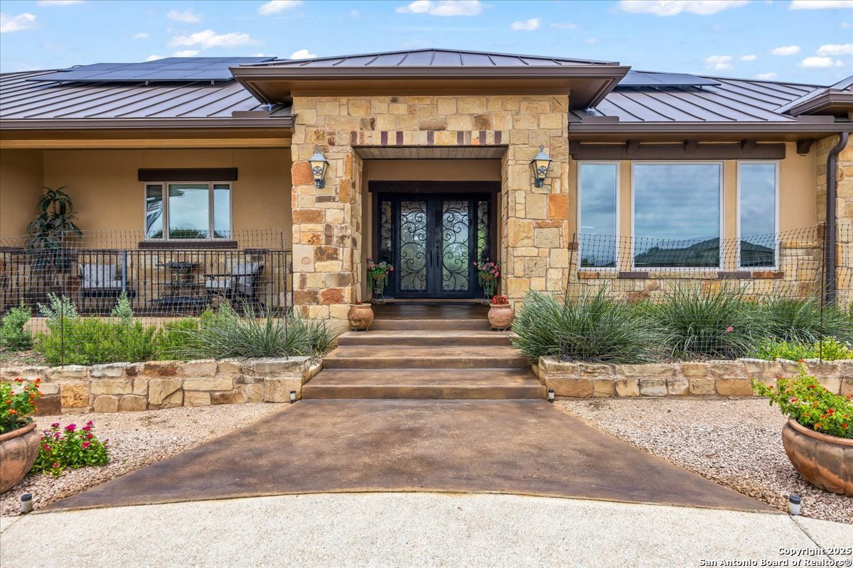 742 Pacific Spring Branch, TX 78070 - Photo 3 of 52 front view of a house with potted plants