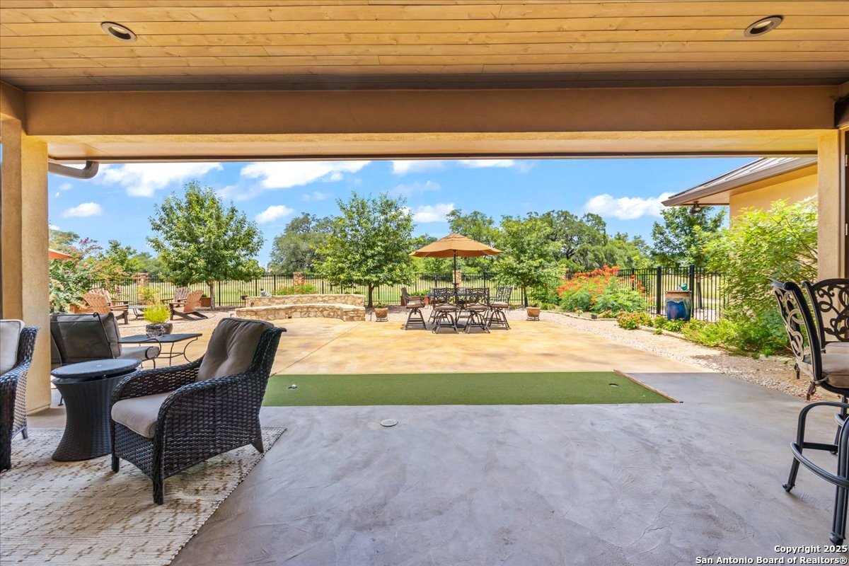 742 Pacific Spring Branch, TX 78070 - Photo 31 of 52 a view of swimming pool with outdoor seating and a floor to ceiling window