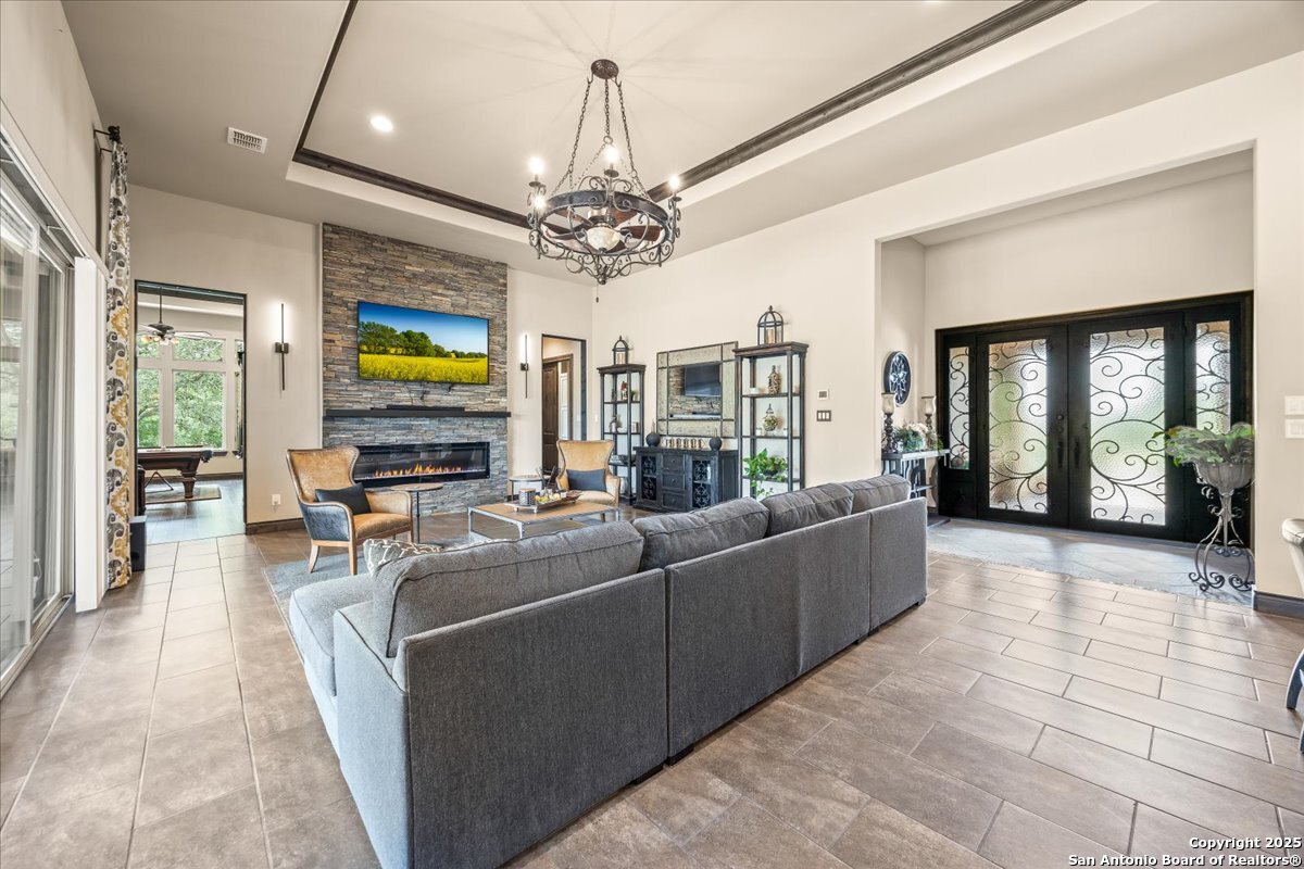 742 Pacific Spring Branch, TX 78070 - Photo 6 of 52 a living room with furniture and a flat screen tv