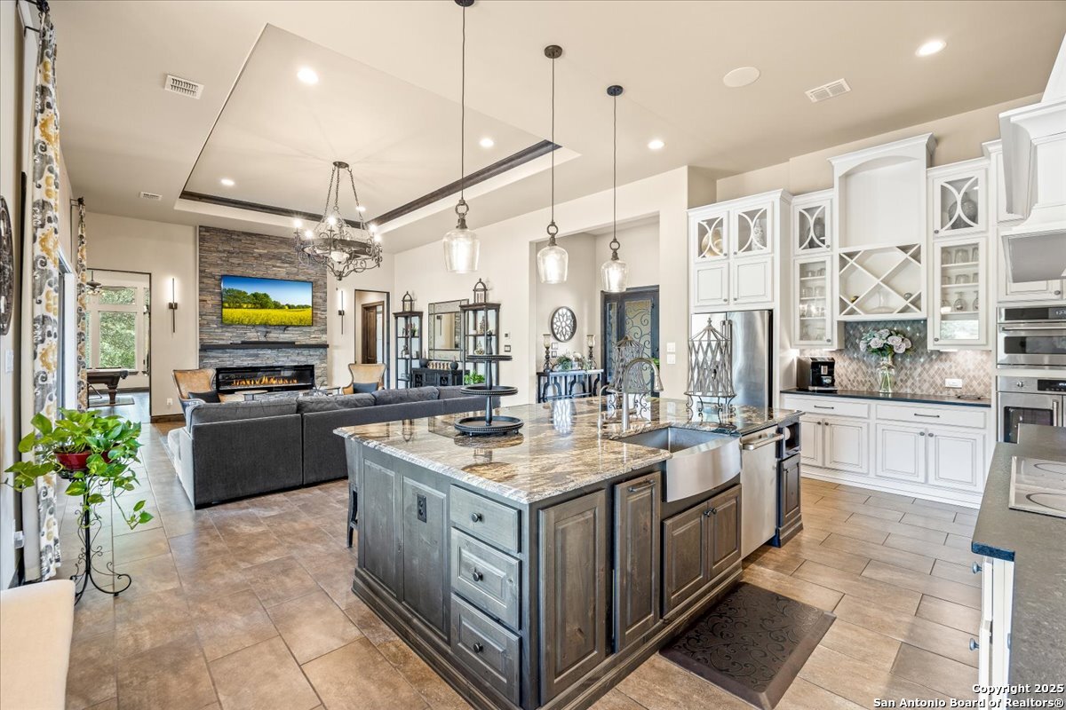 742 Pacific Spring Branch, TX 78070 - Photo 8 of 52 a kitchen with stainless steel appliances granite countertop a stove and a refrigerator