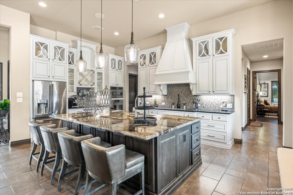 742 Pacific Spring Branch, TX 78070 - Photo 9 of 52 a kitchen with stainless steel appliances granite countertop a sink and cabinets