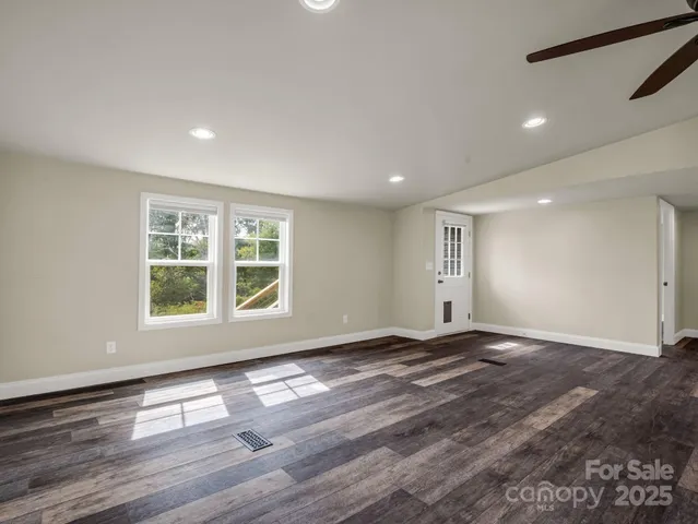 a view of a kitchen with a sink and a stove