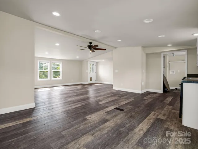 a white toilet sitting next to a white sink