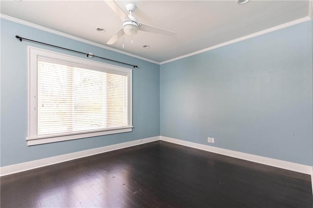 1022 Reeder Circle Northeast Atlanta, GA 30306 - Photo 13 of 37 an empty room with wooden floor and windows