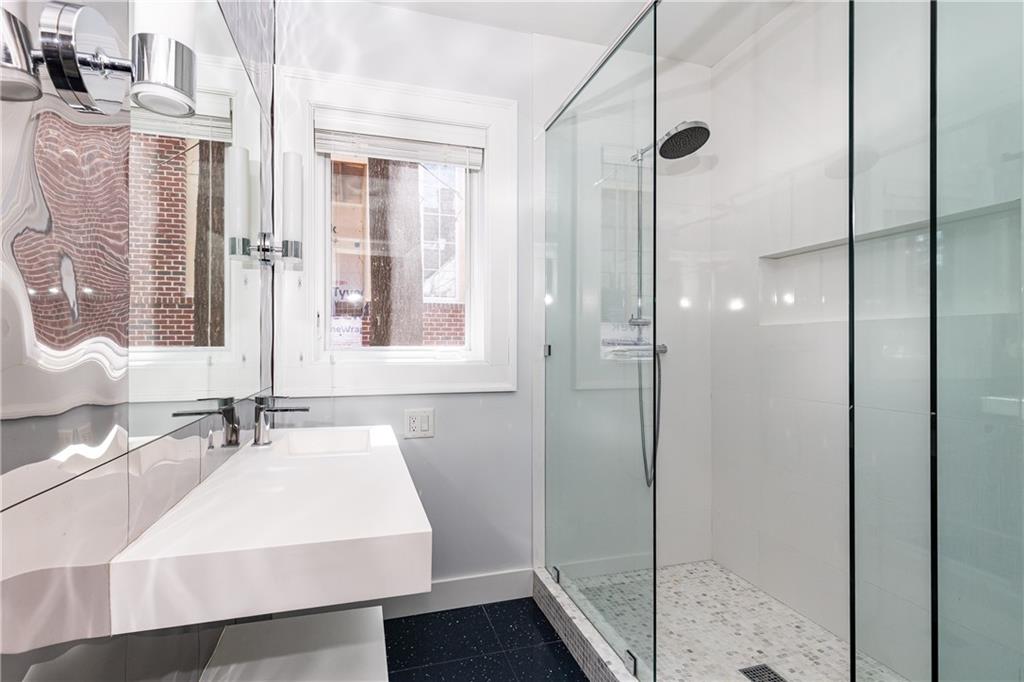 1022 Reeder Circle Northeast Atlanta, GA 30306 - Photo 16 of 37 a bathroom with a sink and a mirror