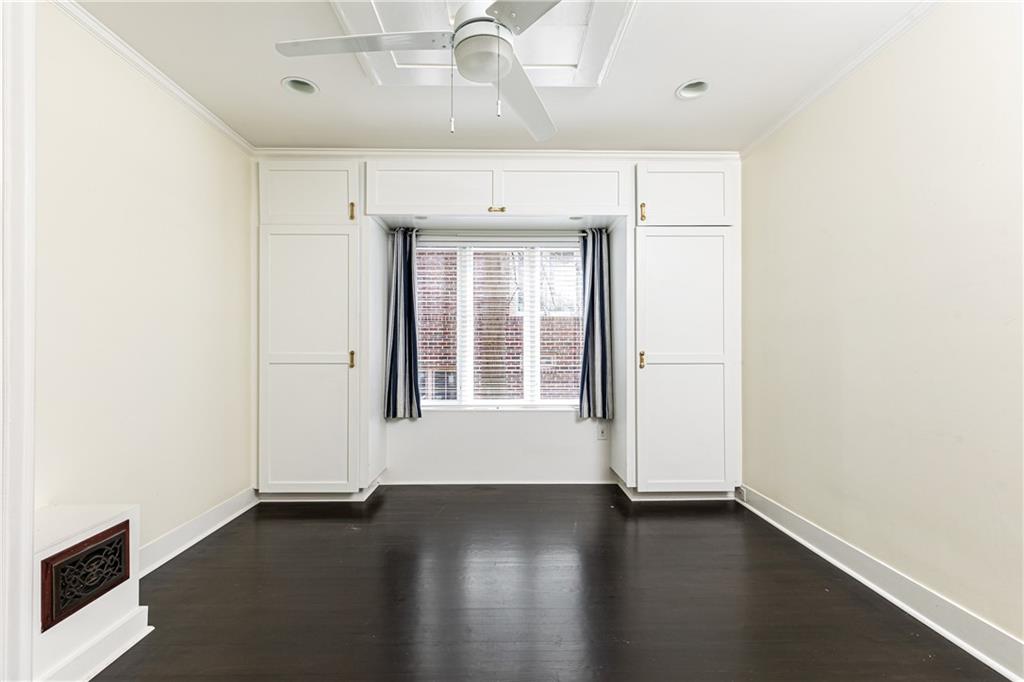 1022 Reeder Circle Northeast Atlanta, GA 30306 - Photo 18 of 37 an empty room with wooden floor and windows