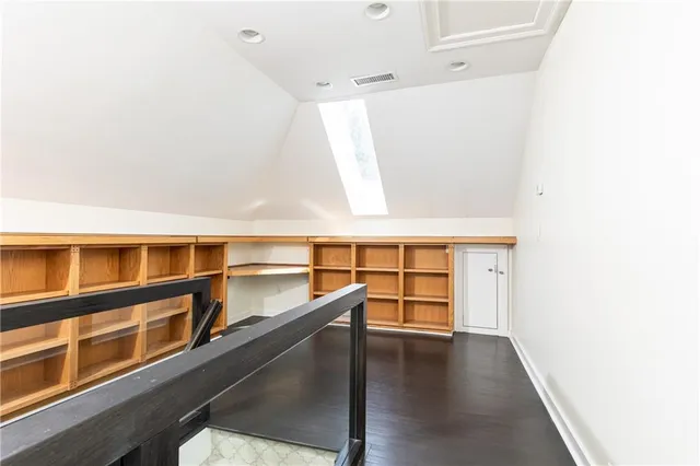a hallway with cabinets