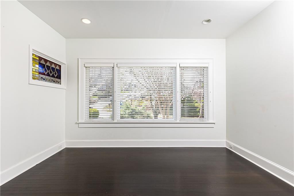 1022 Reeder Circle Northeast Atlanta, GA 30306 - Photo 7 of 37 an empty room with wooden floor and windows