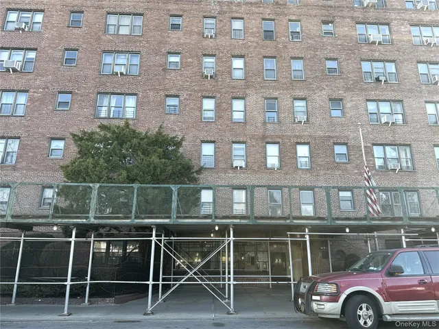 a front view of a house with parking space