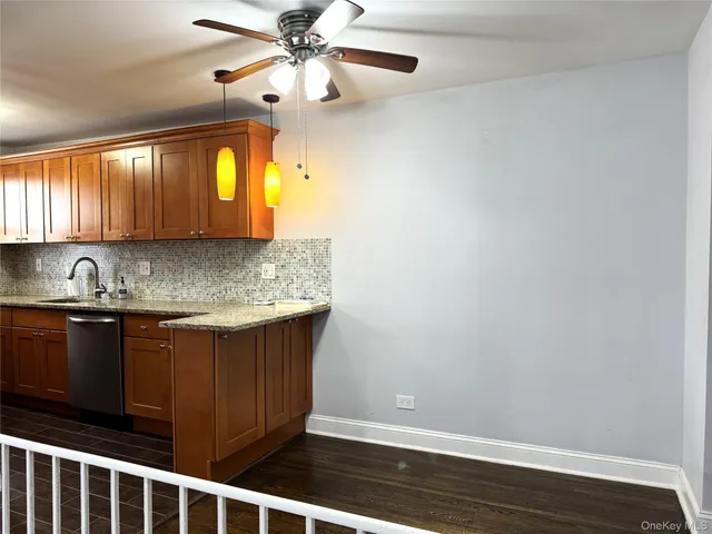 a kitchen with a sink cabinets and window