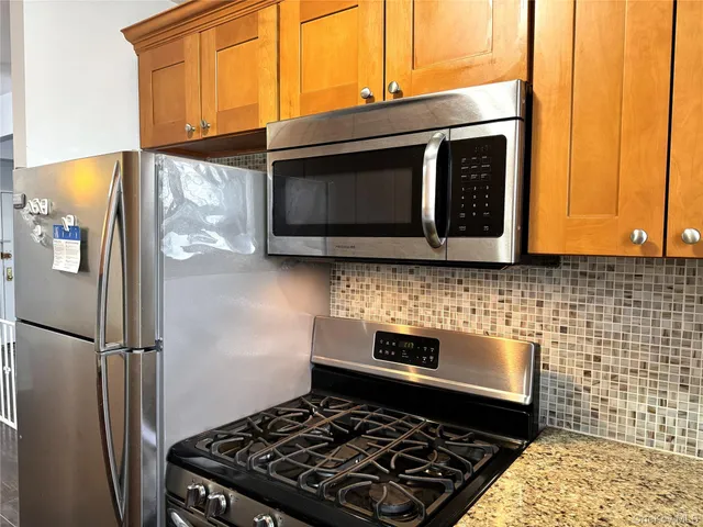 a kitchen with a stove and a microwave