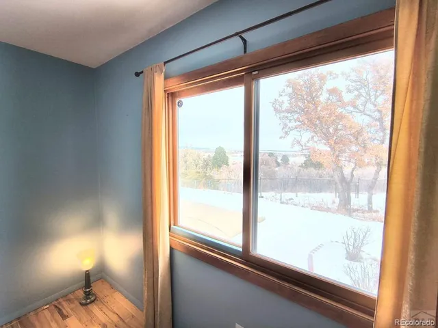 a view of a room with a large window