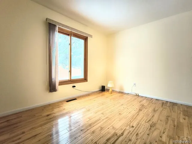 a view of an empty room and window