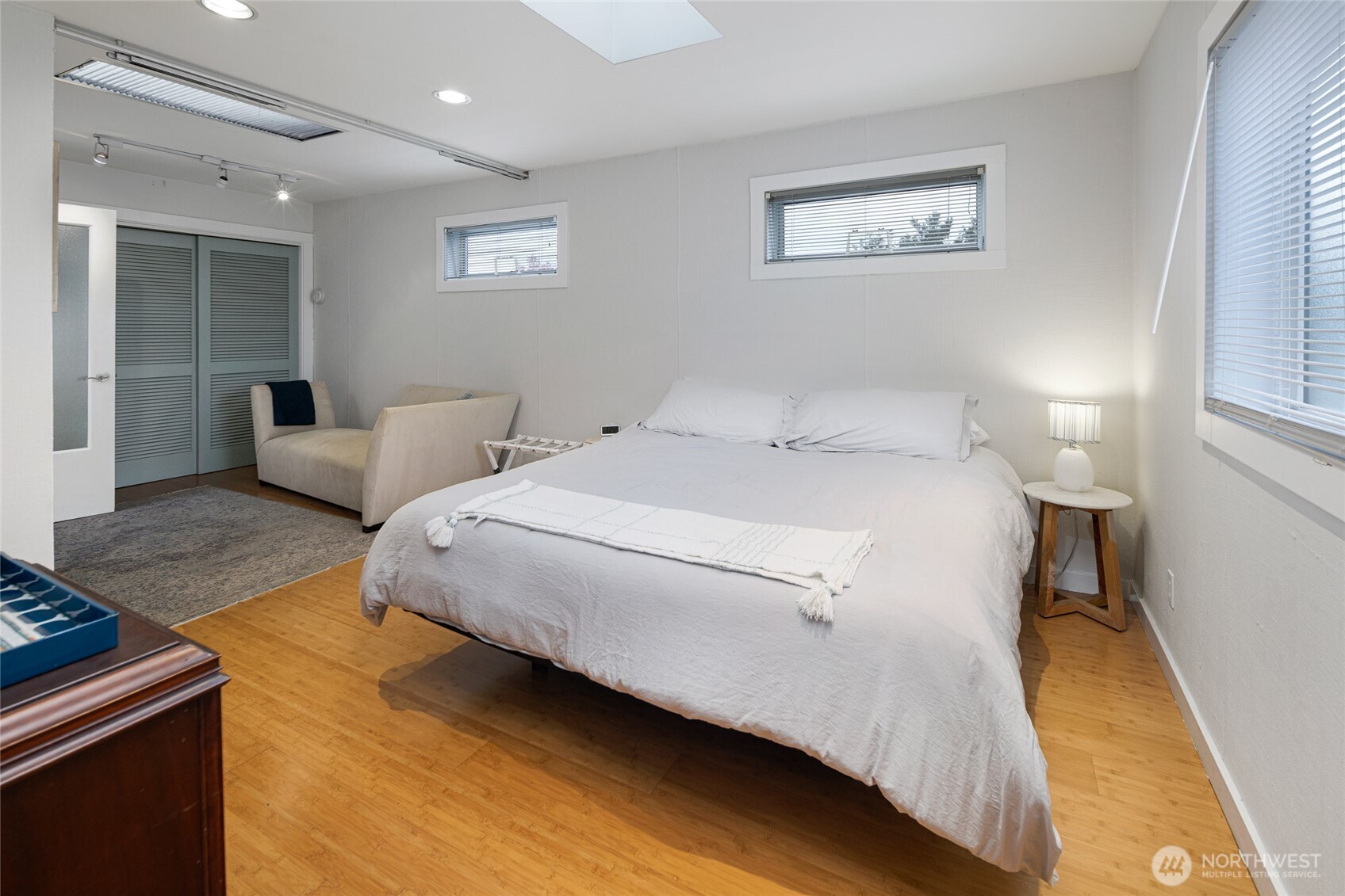 310 Spring Street, Unit F Friday Harbor, WA 98250 - Photo 12 of 20 a bed room with a bed and a couch