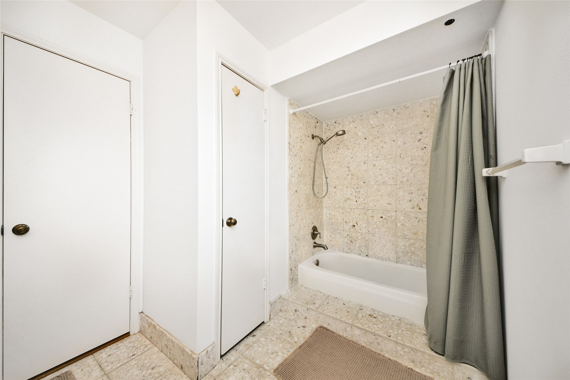 3030 Bernadette Lane Houston, TX 77043 - Photo 17 of 31 a bathroom with a shower and a glass door
