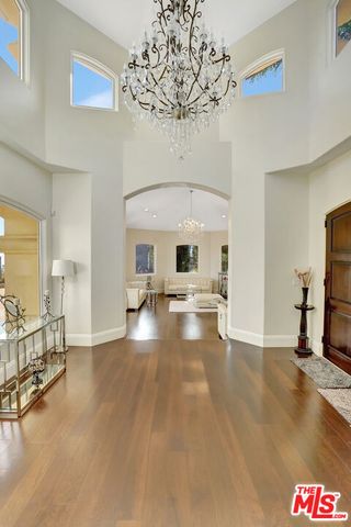 a view of a living room and chandelier