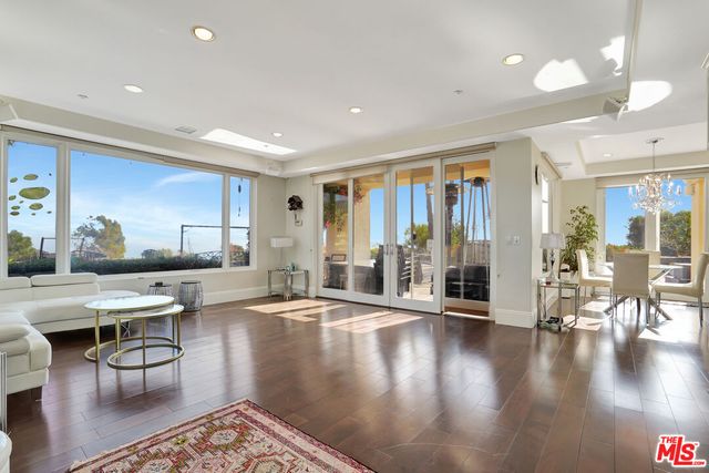 a kitchen with a refrigerator and cabinets