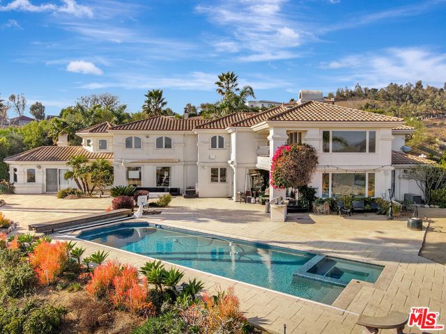 a front view of a houses with yard