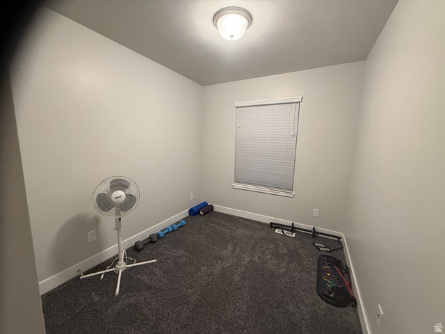 485 370 South Preston, ID 83263 - Photo 15 of 16 Unfurnished room featuring baseboards and dark carpet