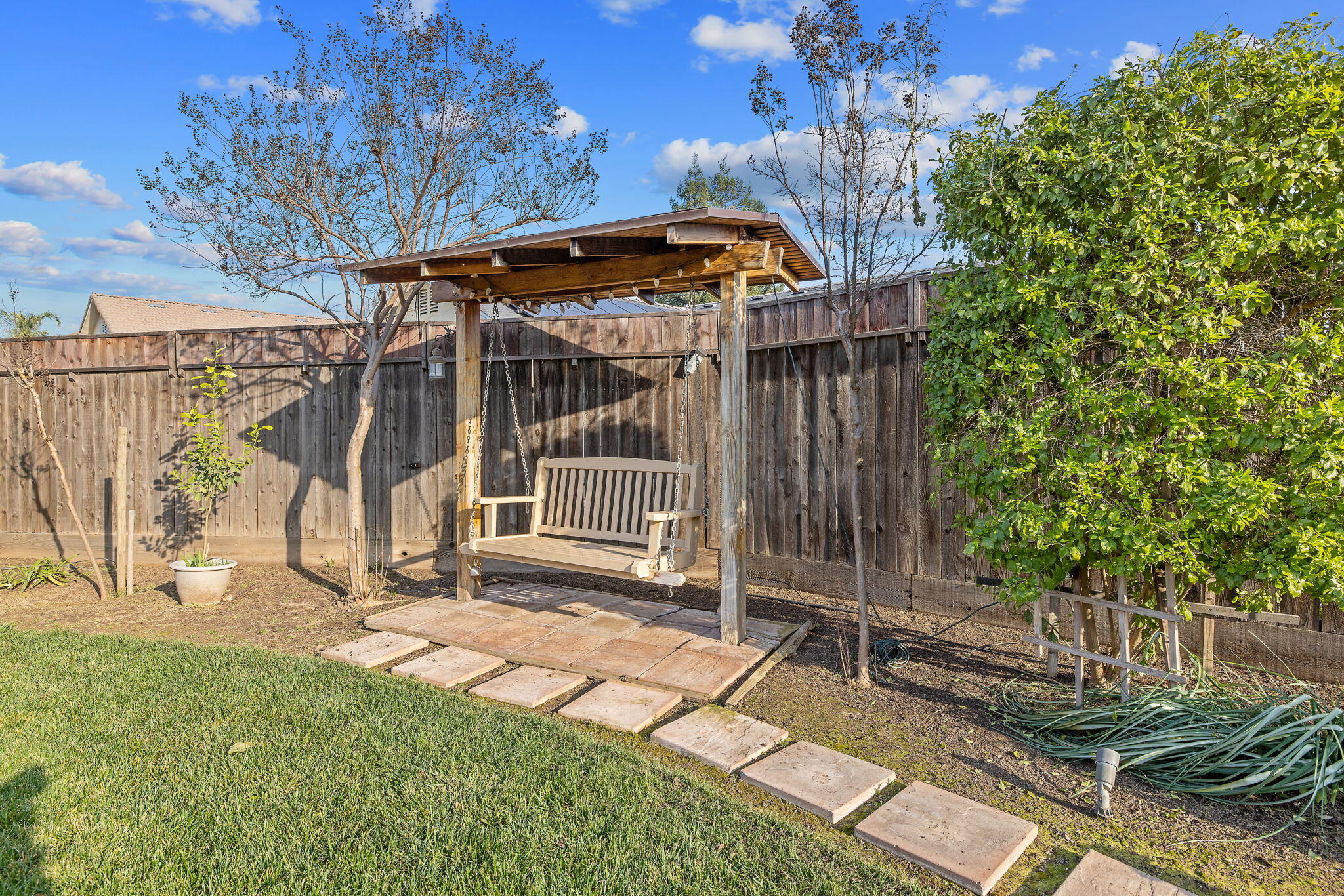 729 St Thomas Court Exeter, CA 93221 - Photo 51 of 66 a view of a backyard with a small cabin