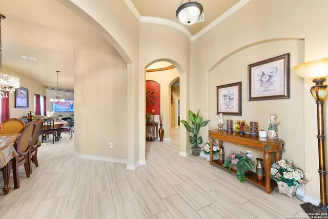 a view of a livingroom with wooden floor and furniture