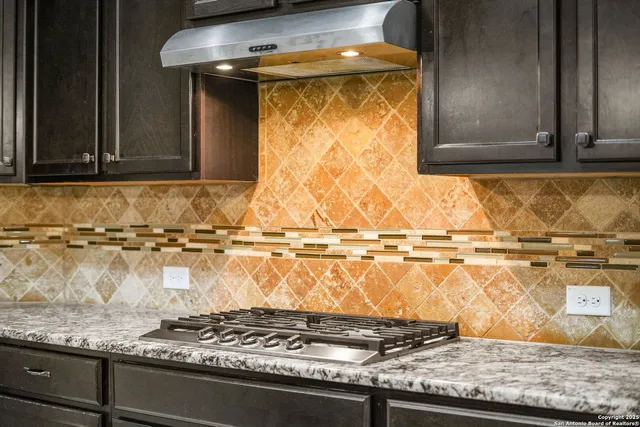 a black and white photo of a stove