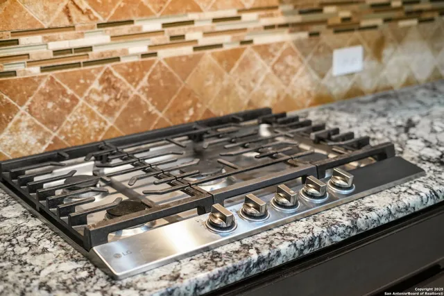a view of a hallway with furniture and chandelier