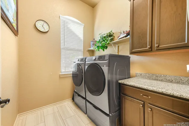 a view of a patio with a table and chairs