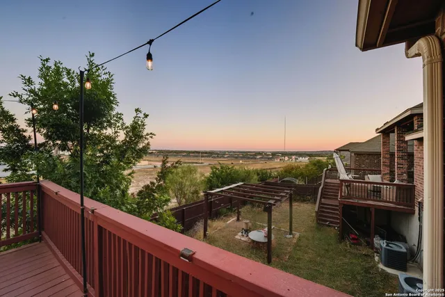 a view of balcony with wooden floor
