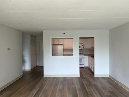 a view of kitchen and wooden floor