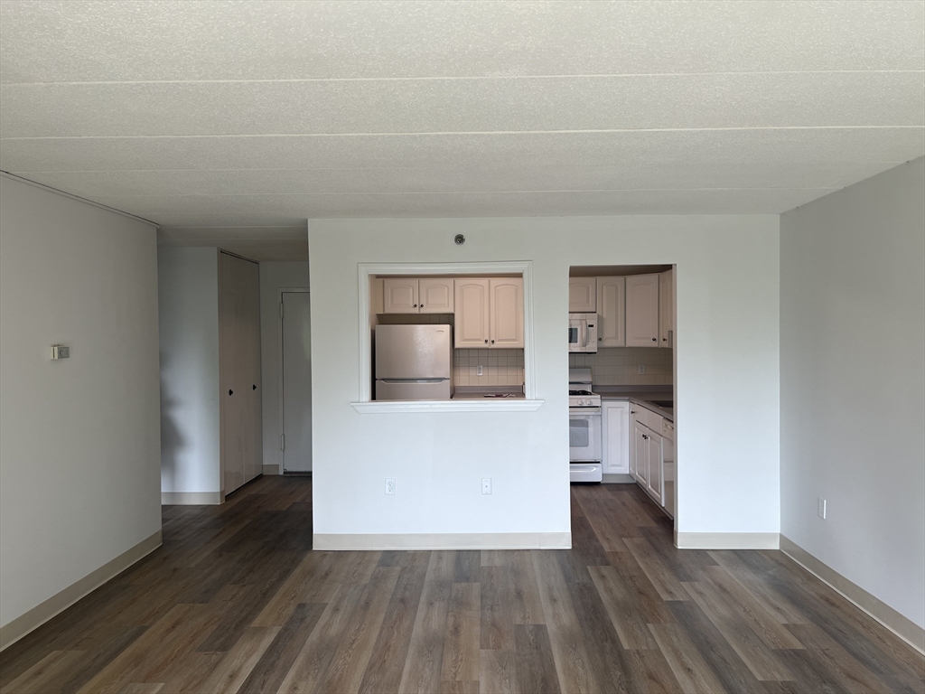1 Pond Street, Unit 8K Winthrop, MA 02152 - Photo 4 of 14 a view of kitchen and wooden floor