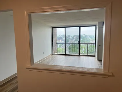 a bathroom with a bathtub and window