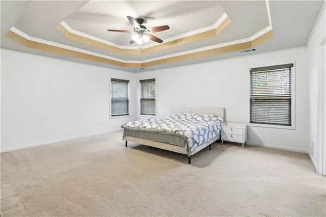 a bedroom with a bed a chandelier and closet