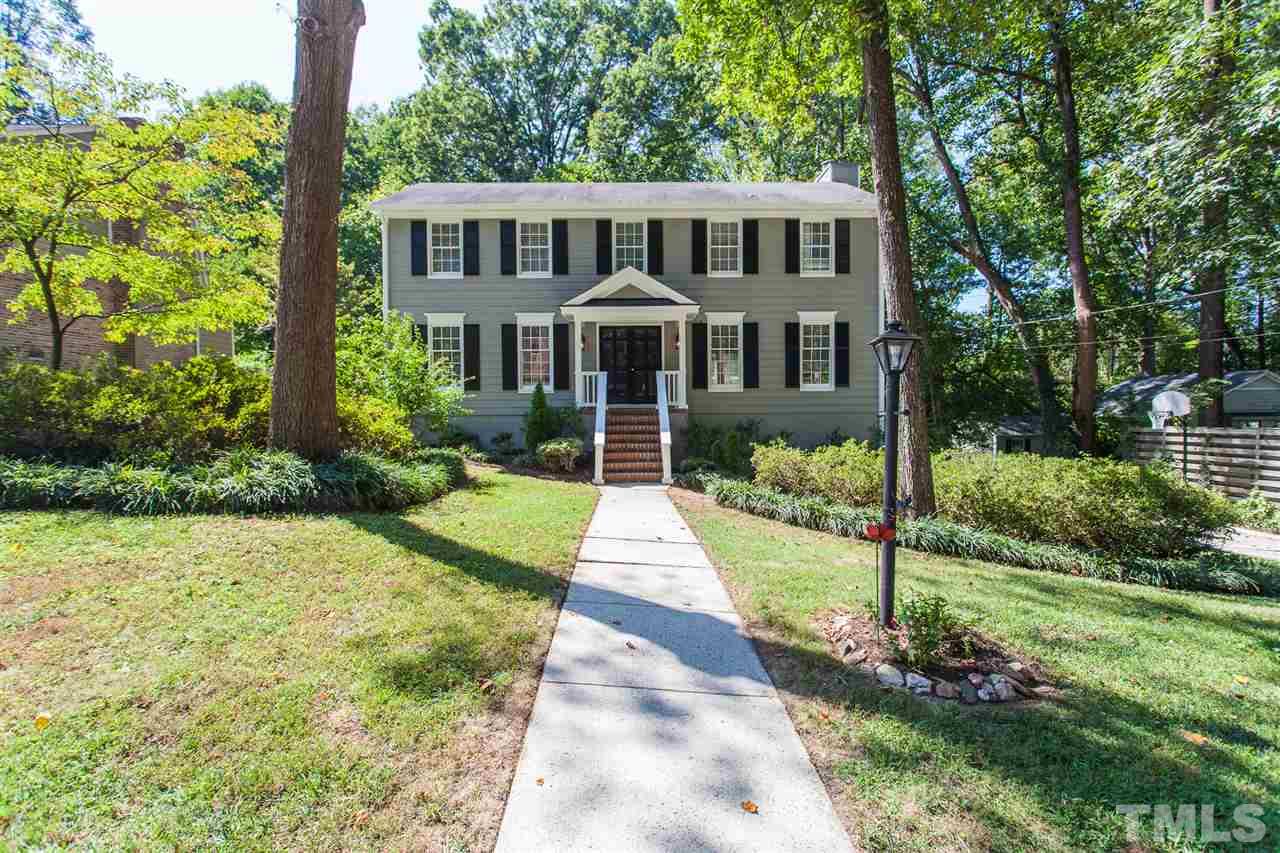 2003 Nancy Ann Drive Raleigh, NC 27607 - Photo 2 of 30 a front view of a house with a yard and potted plants