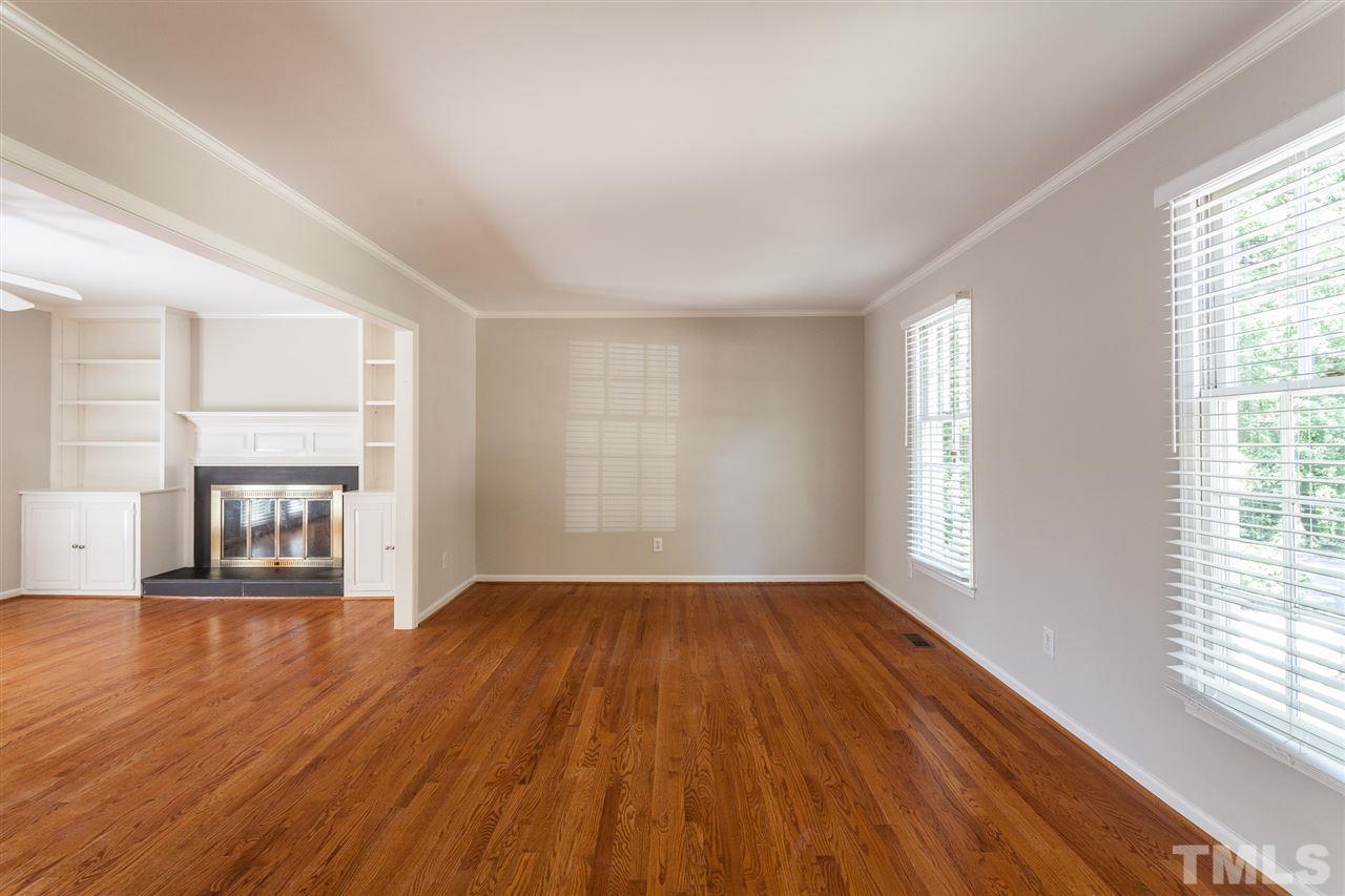 2003 Nancy Ann Drive Raleigh, NC 27607 - Photo 11 of 30 an empty room with wooden floor and windows
