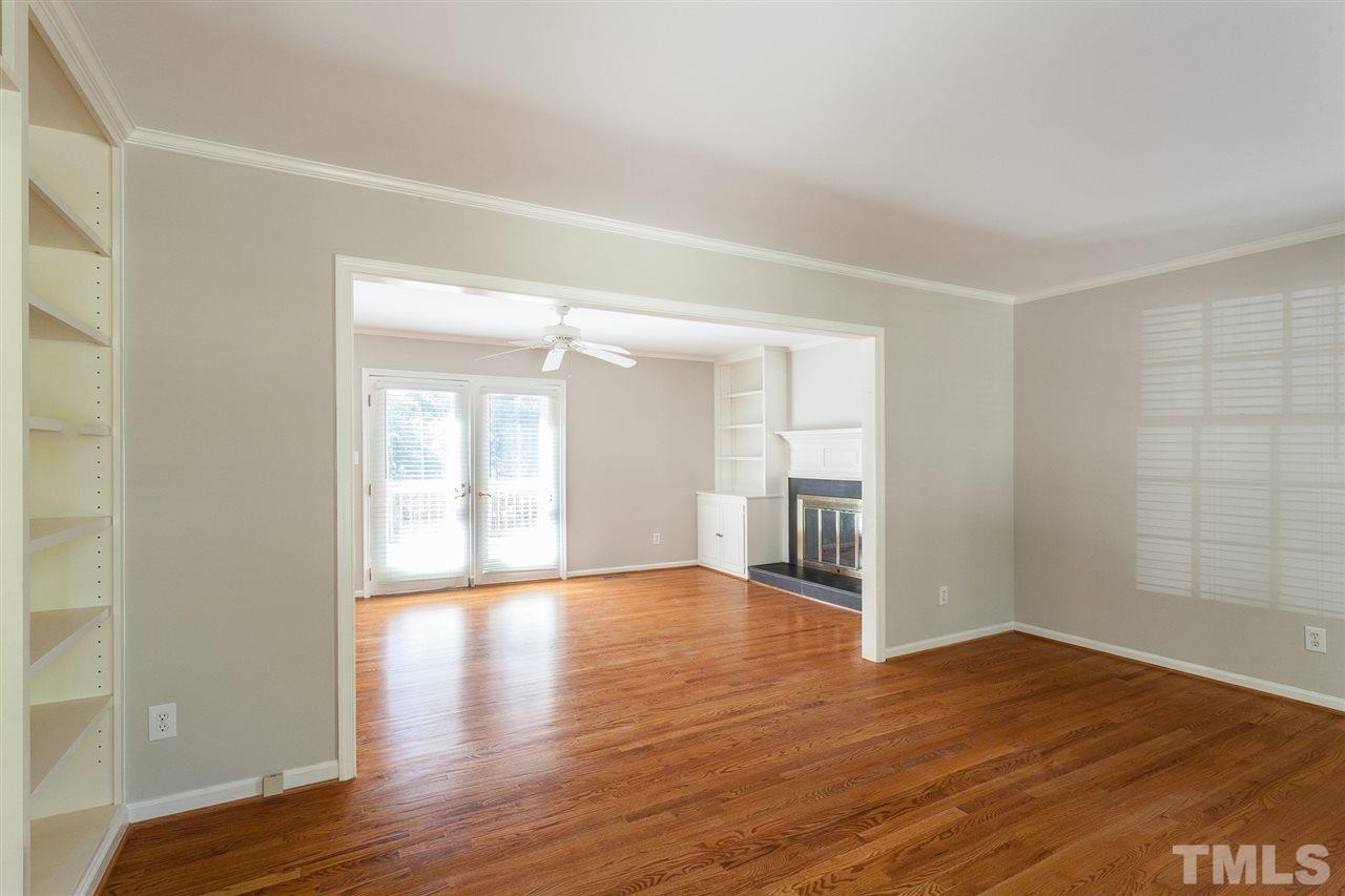 2003 Nancy Ann Drive Raleigh, NC 27607 - Photo 12 of 30 a view of an empty room with wooden floor and a window