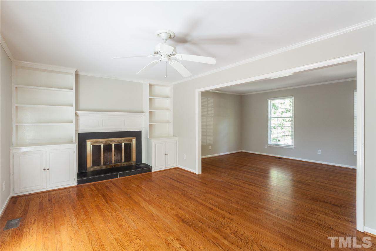 2003 Nancy Ann Drive Raleigh, NC 27607 - Photo 14 of 30 an empty room with windows and fireplace