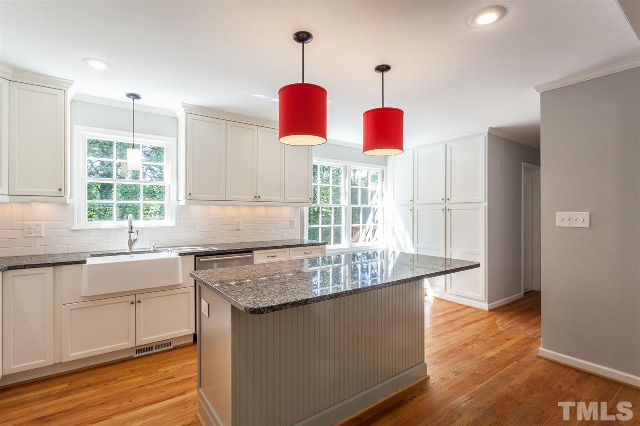 2003 Nancy Ann Drive Raleigh, NC 27607 - Photo 17 of 30 a kitchen with granite countertop cabinets and window