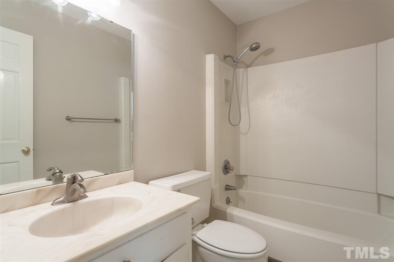 2003 Nancy Ann Drive Raleigh, NC 27607 - Photo 28 of 30 a bathroom with a sink toilet and shower