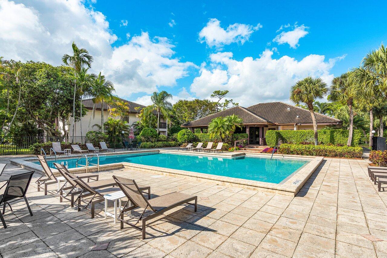 9346 Sable Ridge Circle, Unit B Boca Raton, FL 33428 - Photo 22 of 25 a view of a swimming pool with a patio