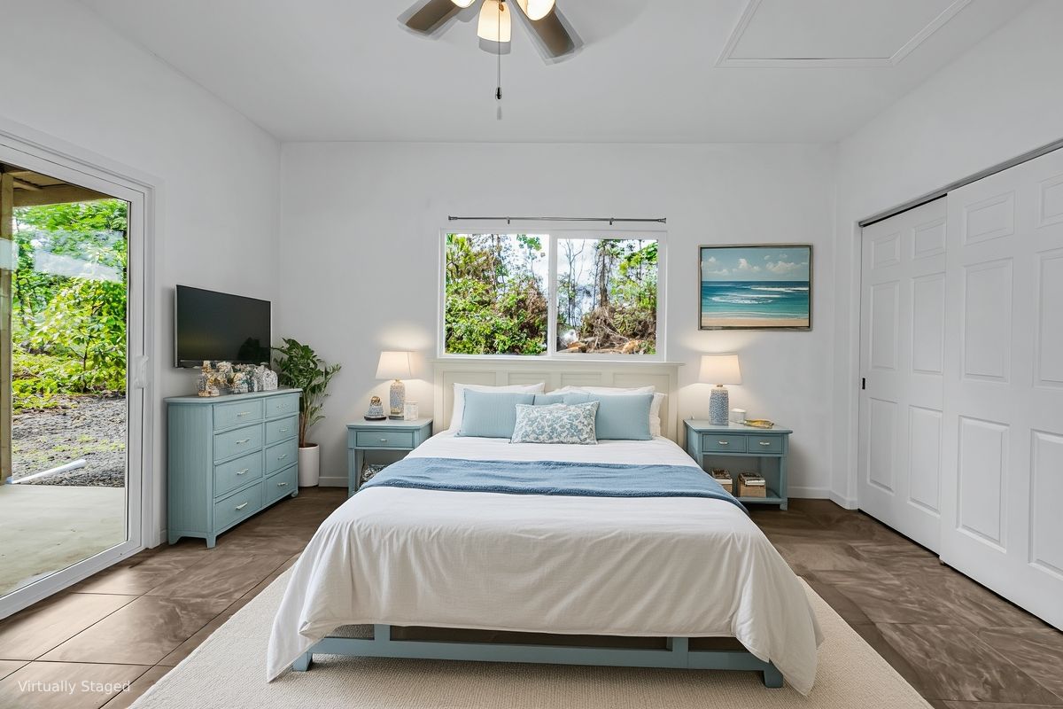 15-1136 Ama U Road Keaau, HI 96749 - Photo 13 of 25 a bedroom with a large bed and a window