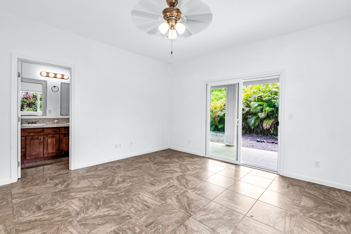 15-1136 Ama U Road Keaau, HI 96749 - Photo 16 of 25 an empty room with windows and cabinet