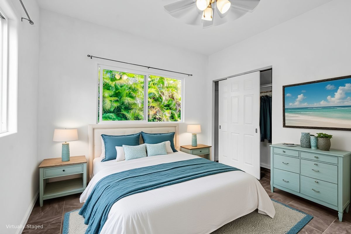 15-1136 Ama U Road Keaau, HI 96749 - Photo 20 of 25 a bedroom with a bed and a chandelier