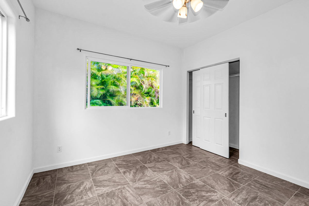 15-1136 Ama U Road Keaau, HI 96749 - Photo 21 of 25 an empty room with a window and a ceiling fan