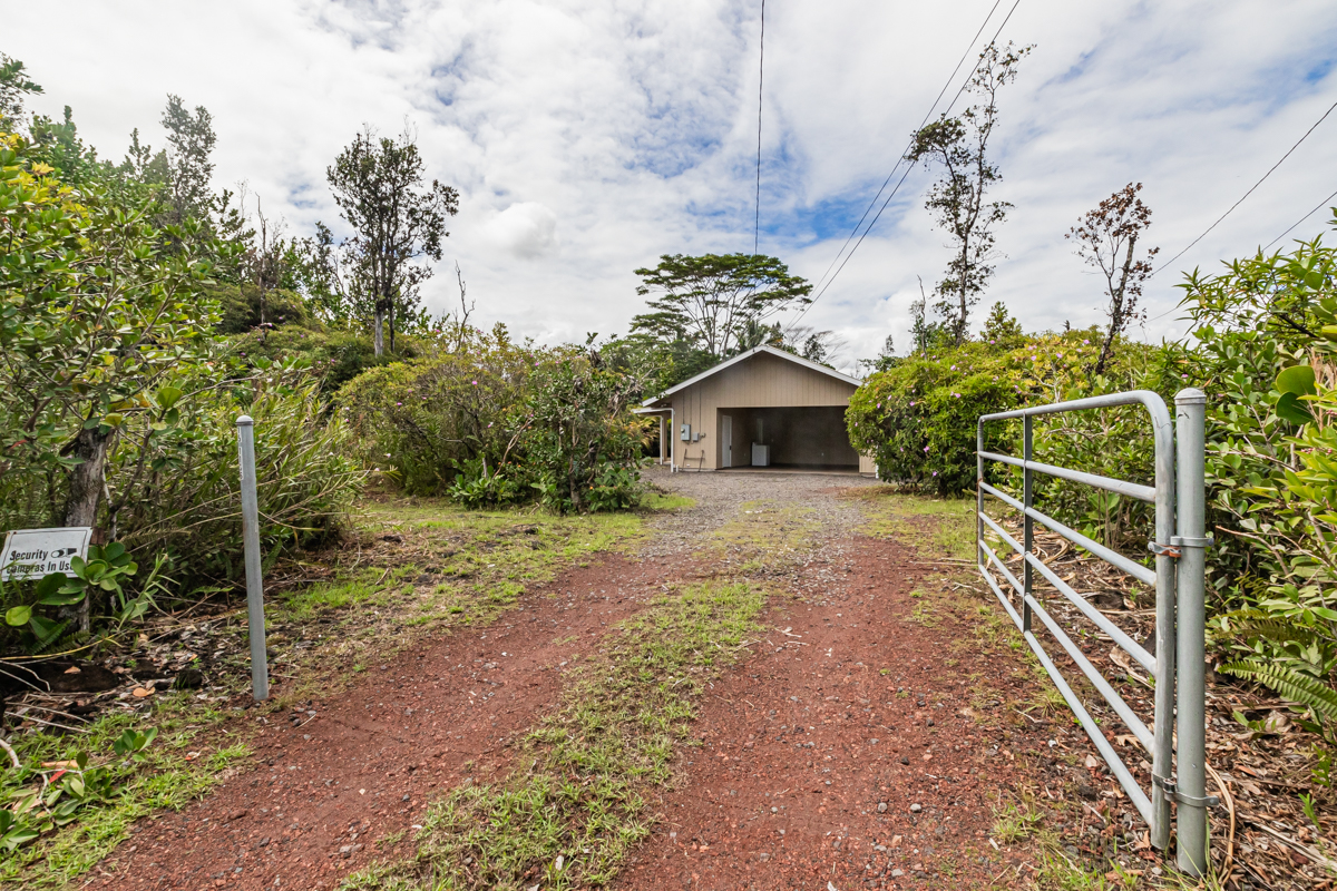 15-1136 Ama U Road Keaau, HI 96749 - Photo 4 of 25 a view of a house with backyard and trees