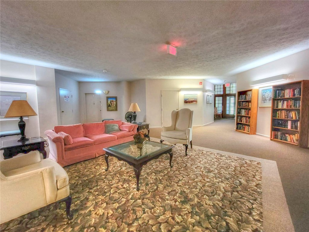 270 Latta Road, Unit UN111 Rochester, NY 14612 - Photo 36 of 40 Main building common area with library