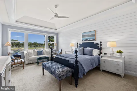 a bedroom with furniture and a window