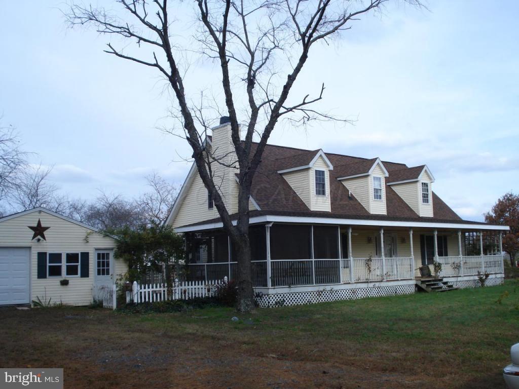 23634 Keen Road Chance, MD 21821 - Photo 1 of 1 a front view of a house with a garden and yard