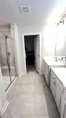 a view of a bathroom with sink and mirror